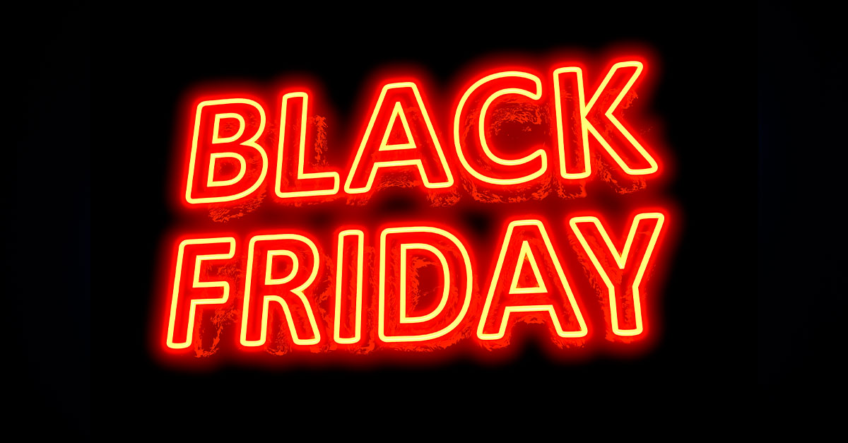 Letreiro de neon vermelho com a frase Black Friday, representando a principal data promocional do varejo.